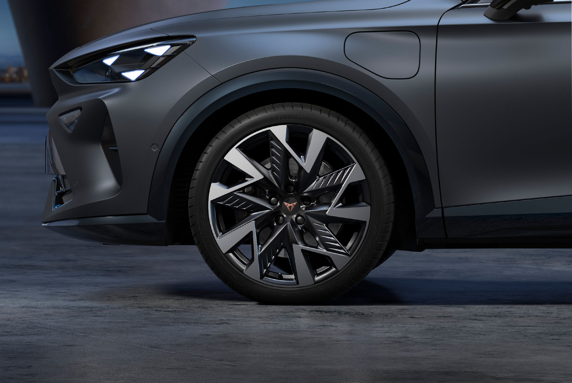 Sandstorm black and silver new CUPRA Formentor 2024 alloy car wheels and tyres with logo in the middle.