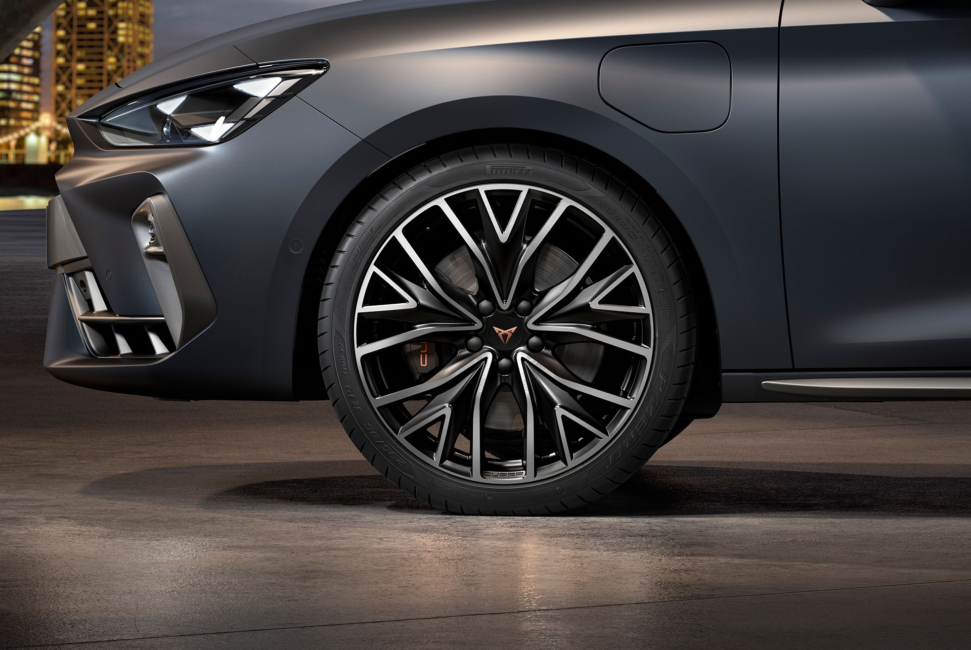 front side view of left mistral machined alloy wheels in silver and black for the new cupra leon sportstourer 2024, tyres, signature headlights and grey body