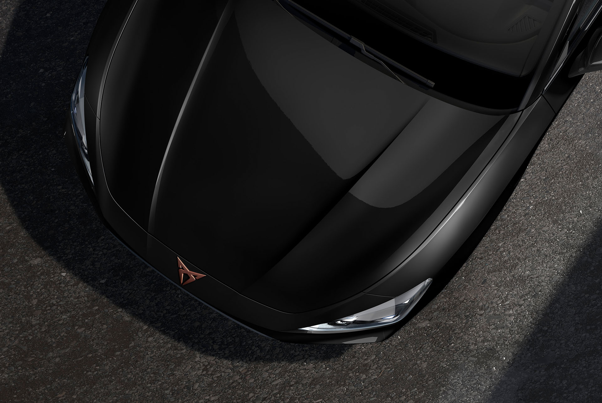 bird’s eye view of a midnight black new cupra leon 2024 car hood
