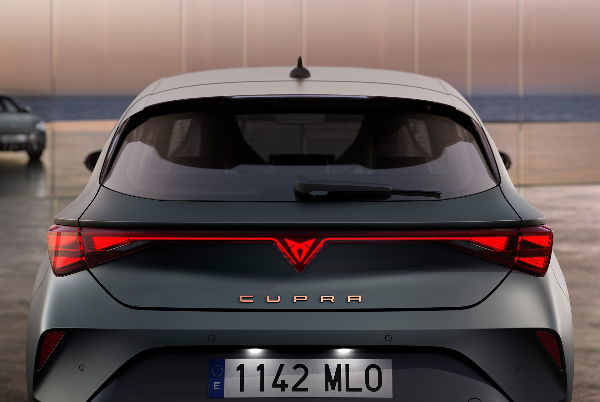 view of new cupra leon 2024 hybrid car's boot and rear lights, LED lighting, integrated led cupra logo